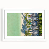 Abstract art print of a Tahitian landscape in cool blue and green hues on a white framed canvas.