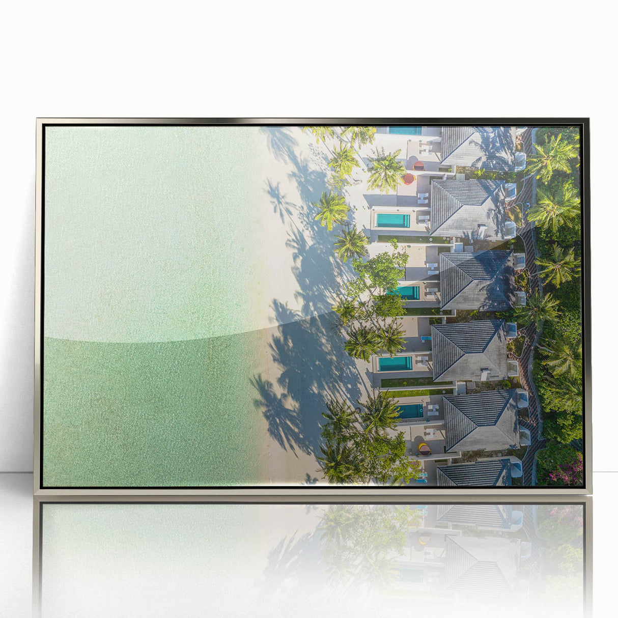Mid-century modernist art of Tahitian scenery in silver-framed acrylic, featuring lush greens and ocean blues.