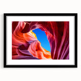 Extra large, colorful abstract art print of Arizona Antelope Canyon in a black frame, ideal for living room decor.