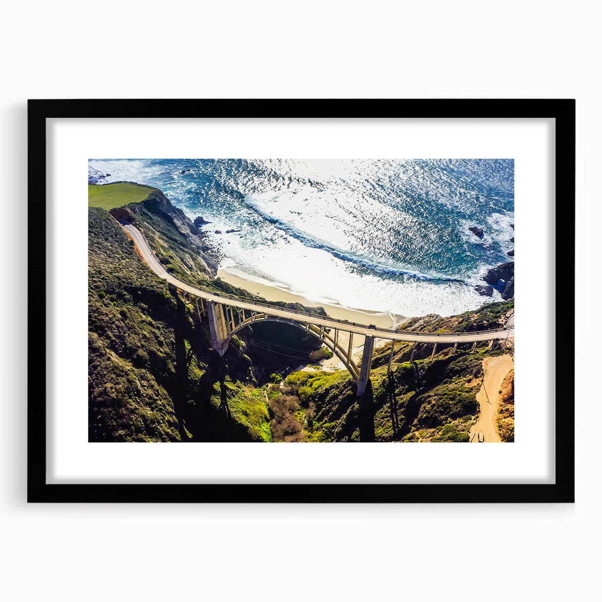 Abstract art print of Big Sur in vibrant colors on a textured, extra large canvas, framed in black.