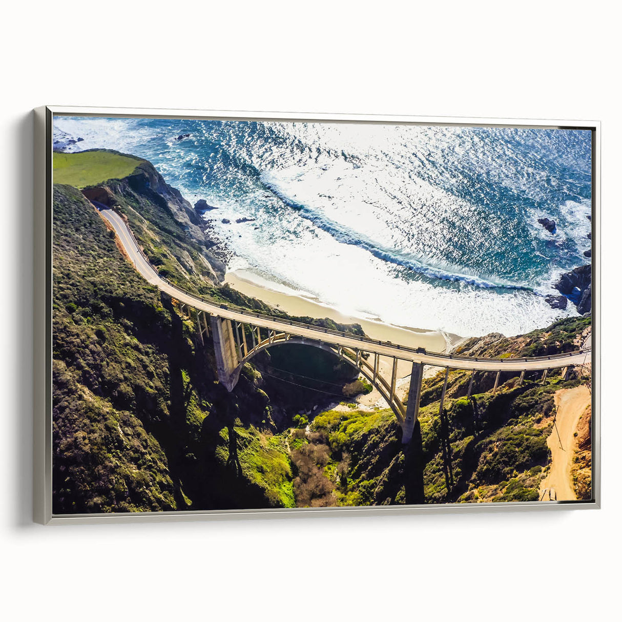 Framed canvas featuring a vintage-style landscape painting of Big Sur, California, with vibrant colors on a black background.