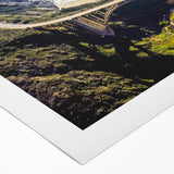 Art deco poster of Big Sur coastline in muted earth tones on rolled canvas, suitable for dining room wall art.