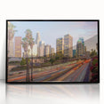 Large abstract wall art featuring a minimalist Los Angeles skyline in muted gray tones on a black framed acrylic print.