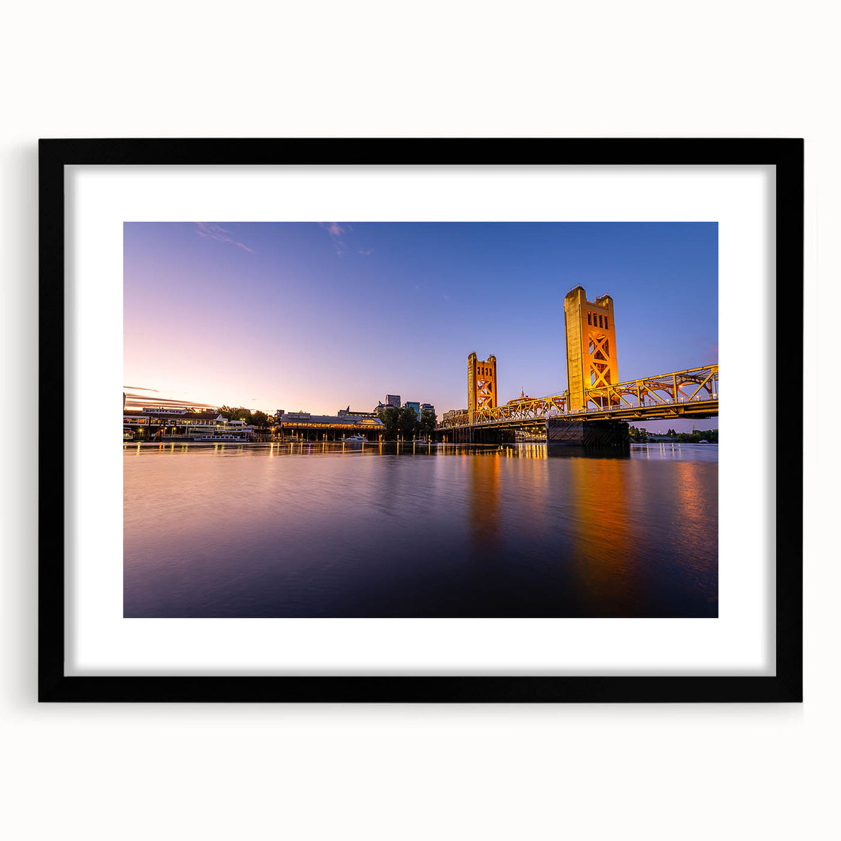 Abstract art print of Sacramento scenery in vibrant colors on a large framed canvas, suitable for living room decor.