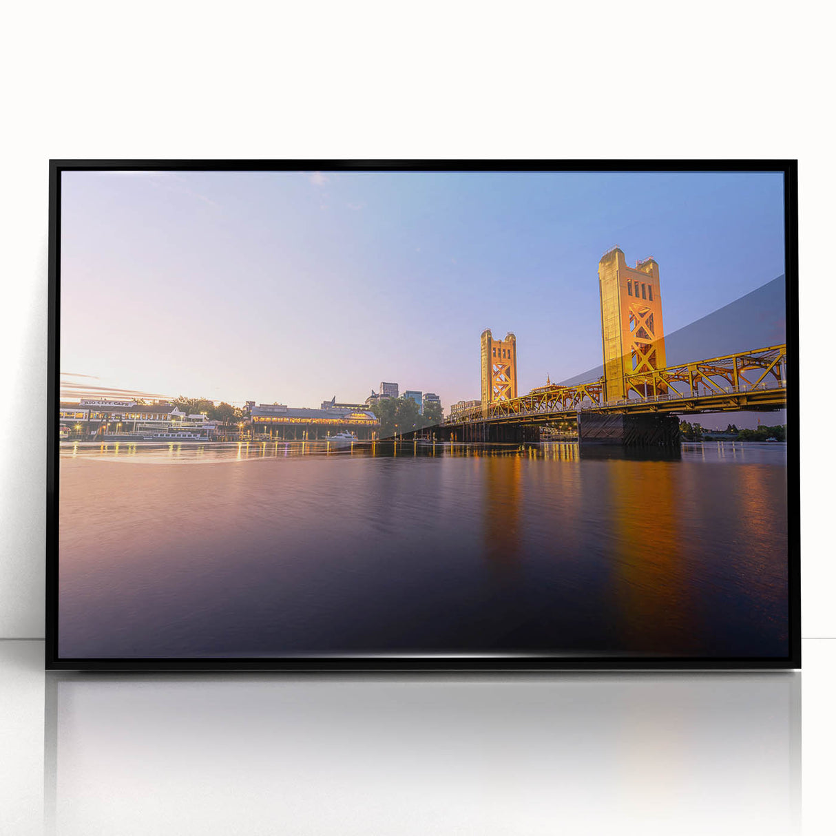 Large abstract wall art depicting the Sacramento skyline in muted gray and blue tones, framed in black acrylic.