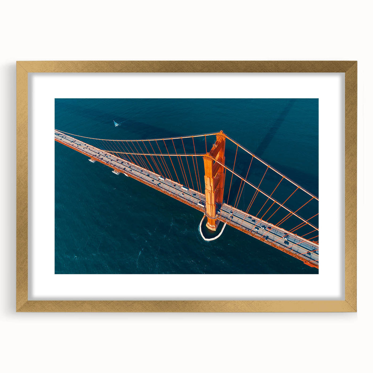 Extra large abstract art print depicting San Francisco scenery in textured blues and golds, framed in gold.