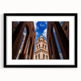 Abstract art print depicting a textured, colorful scenery of Santa Cruz, in a black frame with mat.