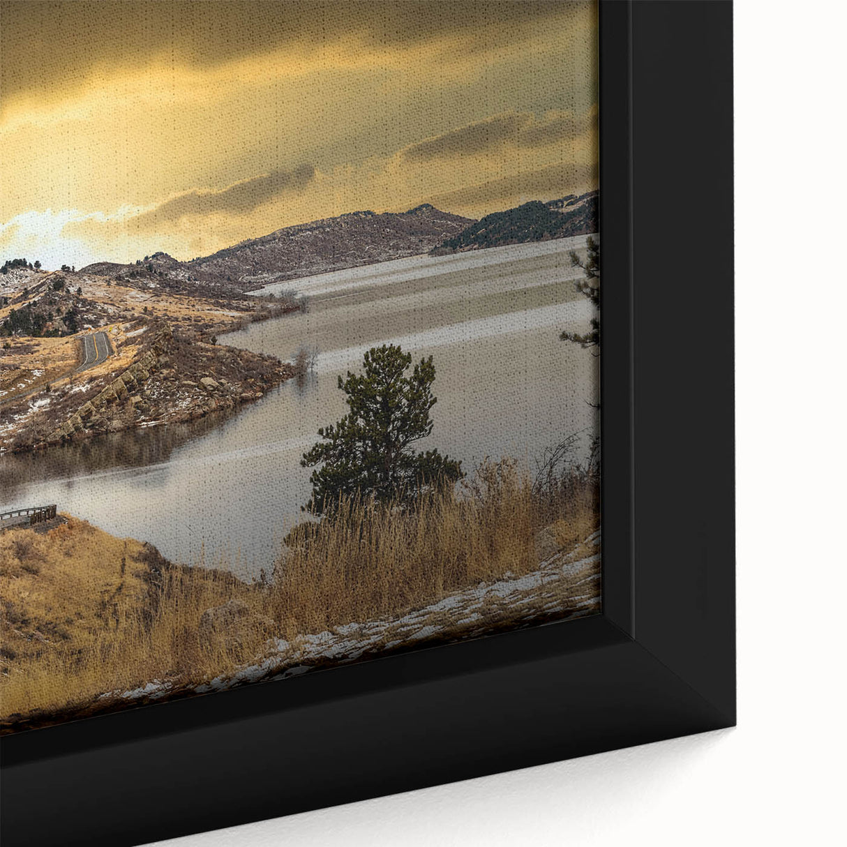 Black wall art featuring a textured depiction of Colorado Springs with vibrant colors on a framed canvas.