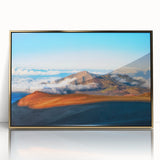 Large art print of a Maui, Hawaii landscape with lush greenery and ocean, framed in gold acrylic.