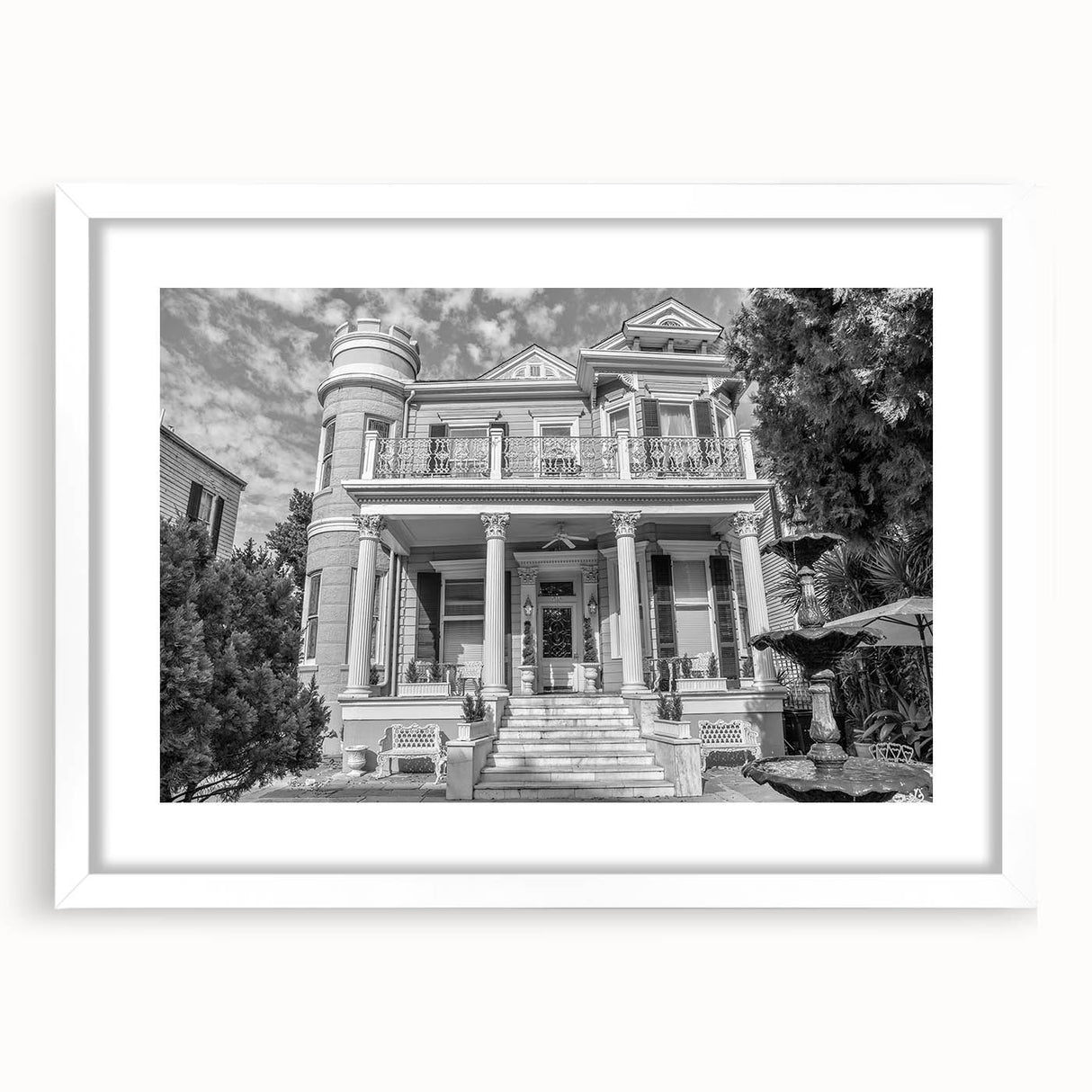 Abstract art print of New Orleans skyline in muted blue and gray tones on a framed white mat, suitable for dining room decor.