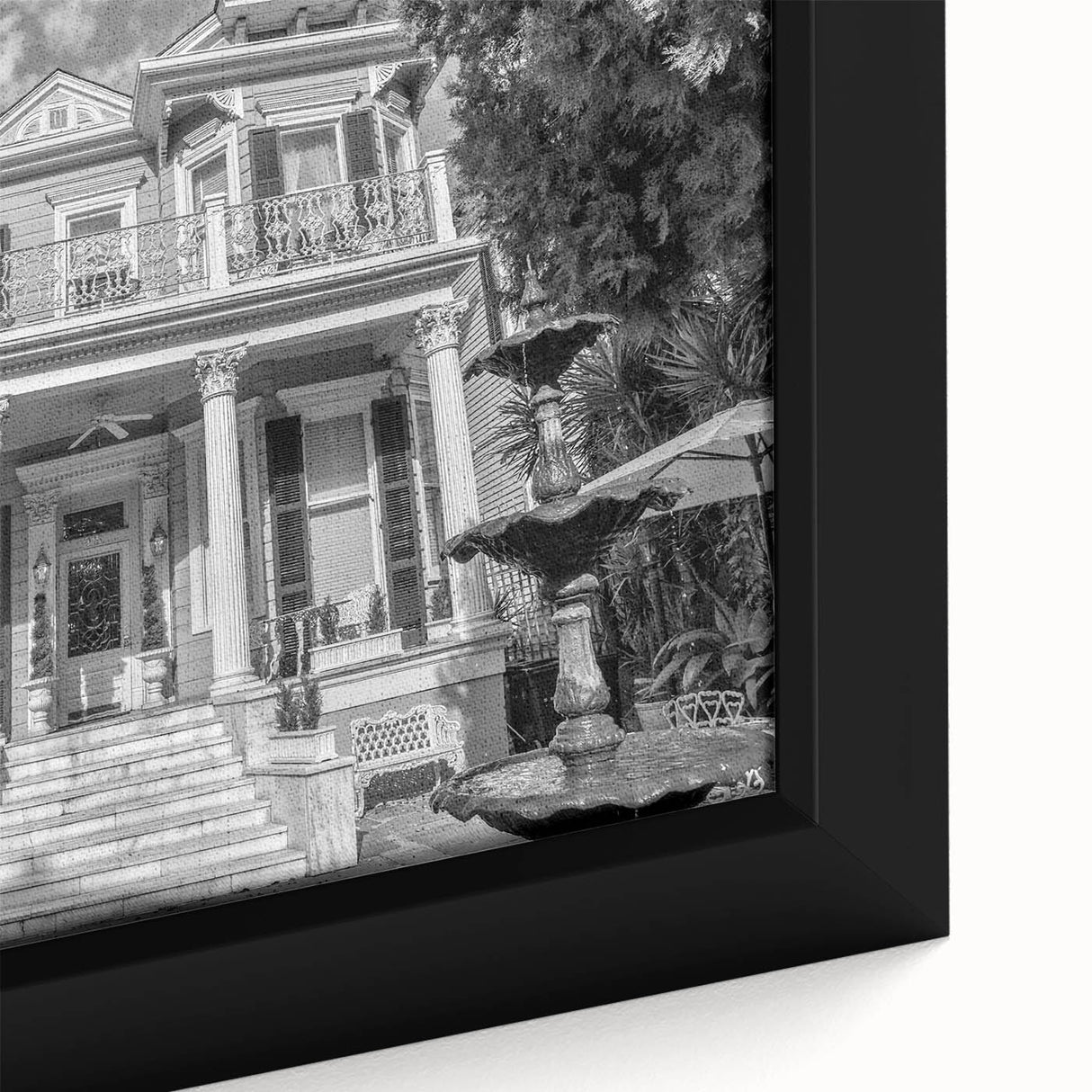 Close-up of textured black wall art featuring a colorful New Orleans scenery on a framed canvas, ideal for living room decor.