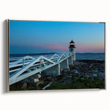 Framed canvas of a vintage-style Maine landscape painting with colorful foliage and a black border.