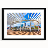 Abstract art print of Charlotte skyline in vibrant colors on a large framed canvas, ideal for living room decor.