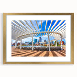 Extra large abstract art print of Charlotte skyline in muted gray, framed in gold, ideal for living room decor.