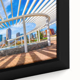 Textured black wall art depicting the Charlotte skyline with colorful accents on a framed canvas.