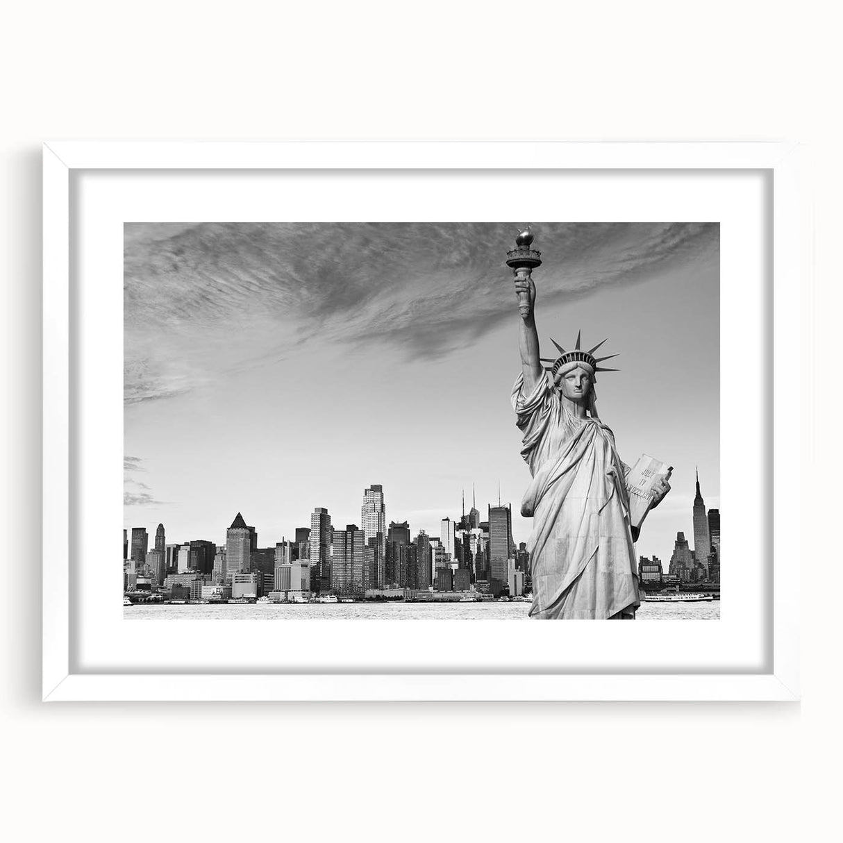 Abstract art print of the Statue of Liberty in muted blue and gray tones on a white framed canvas.