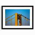 Abstract art print of Pittsburgh skyline in vibrant colors on a large framed canvas, ideal for living room decor.