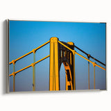 Framed canvas of a colorful Pittsburgh landscape with silver accents, ideal for living room decor.
