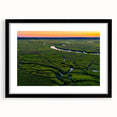 Colorful abstract art print of Charleston scenery in vibrant hues on a large framed canvas, ideal for living room decor.