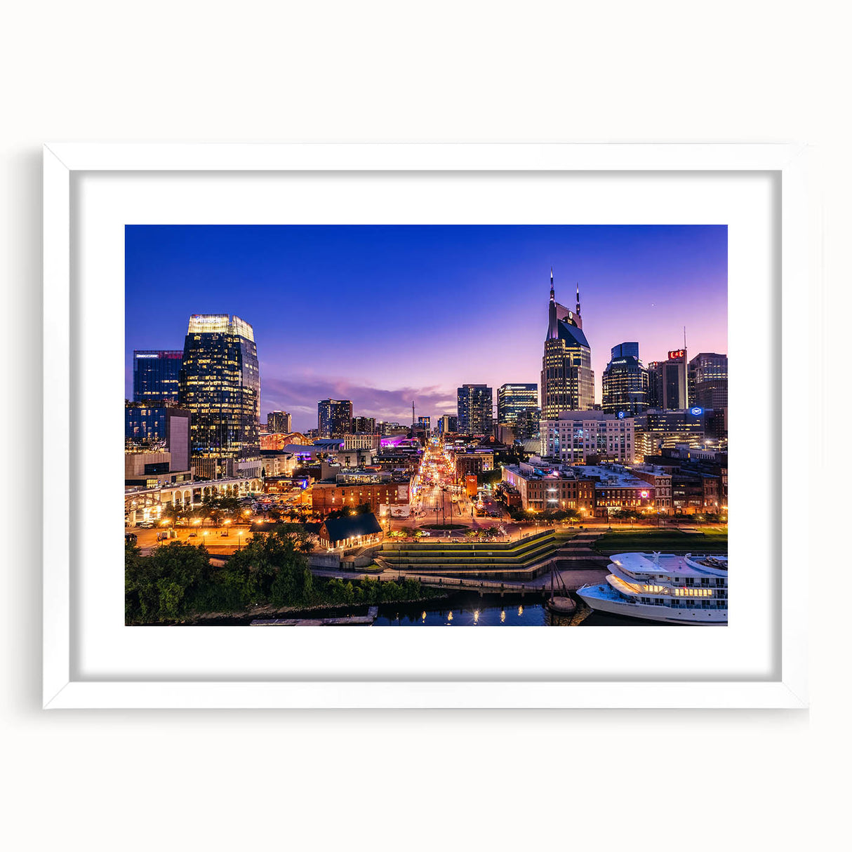 Abstract art print of Nashville skyline in muted gray and blue tones on a framed white mat, ideal for dining room decor.