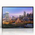 Large abstract wall art depicting the Nashville skyline in muted gray and blue tones, framed in black acrylic.