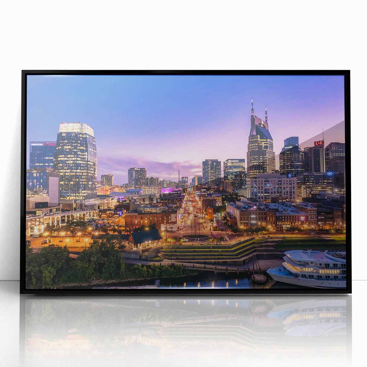 Large abstract wall art depicting the Nashville skyline in muted gray and blue tones, framed in black acrylic.