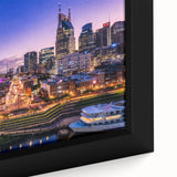 Framed canvas of a textured Nashville skyline in black with colorful accents, ideal for large living room walls.