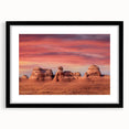 Colorful abstract art print of Utah Arches in a black frame with mat, using vibrant hues, ideal for living room decor.
