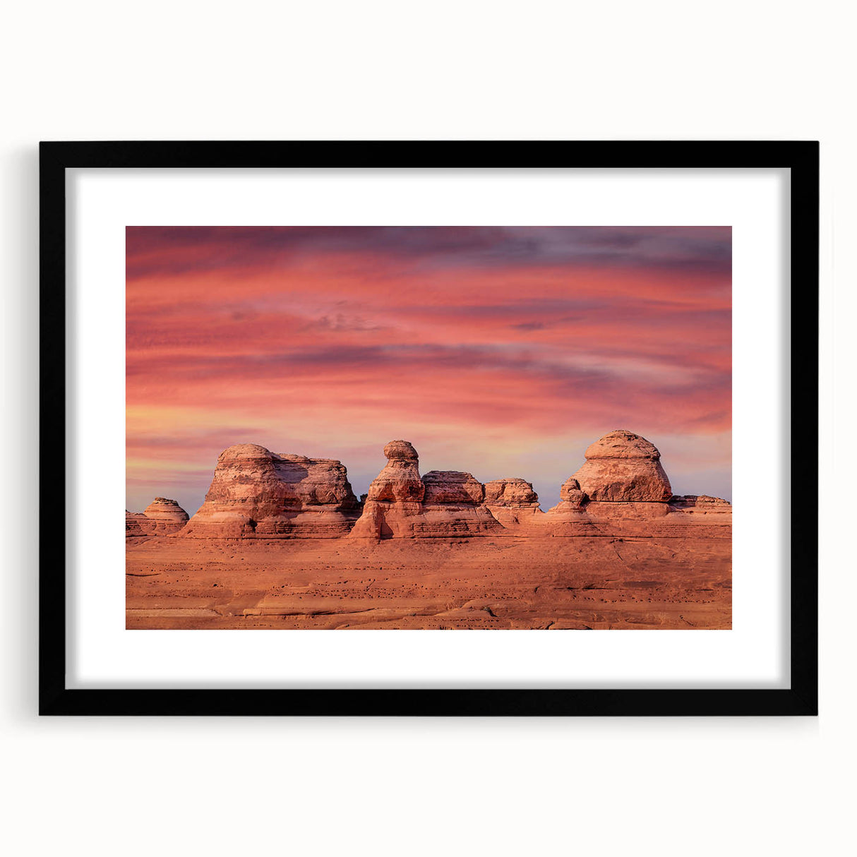 Colorful abstract art print of Utah Arches in a black frame with mat, using vibrant hues, ideal for living room decor.
