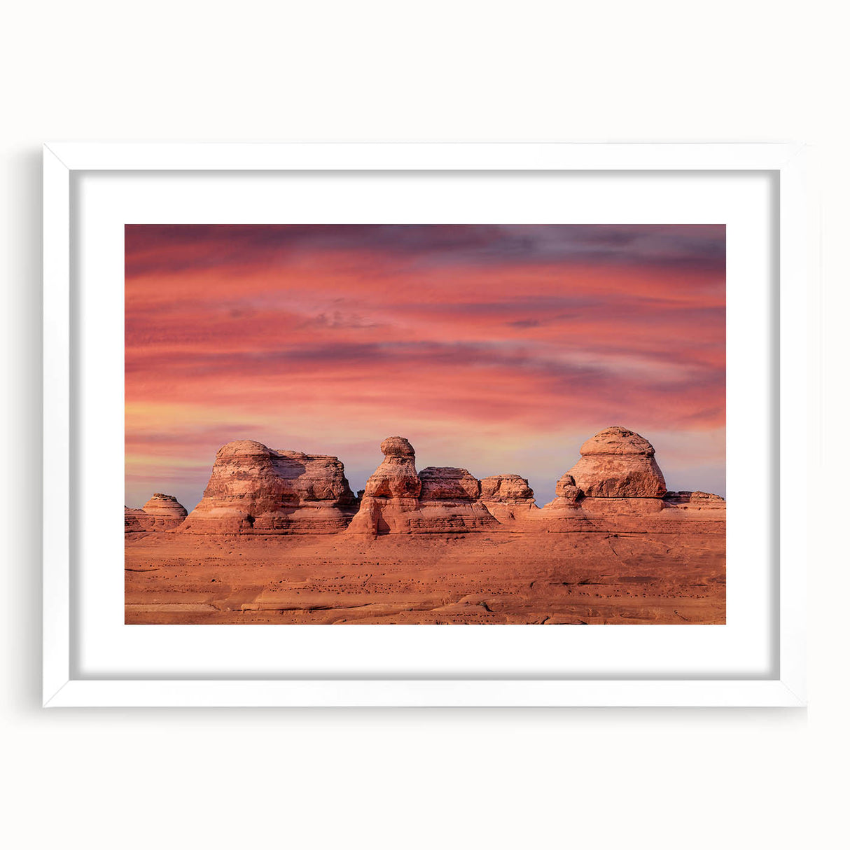 Abstract art print of Utah Arches in muted earth tones on a white-framed canvas, suitable for bedroom or dining room decor.
