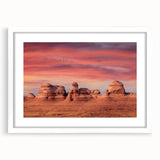 Abstract art print of Utah Arches in muted earth tones on a white-framed canvas, suitable for bedroom or dining room decor.