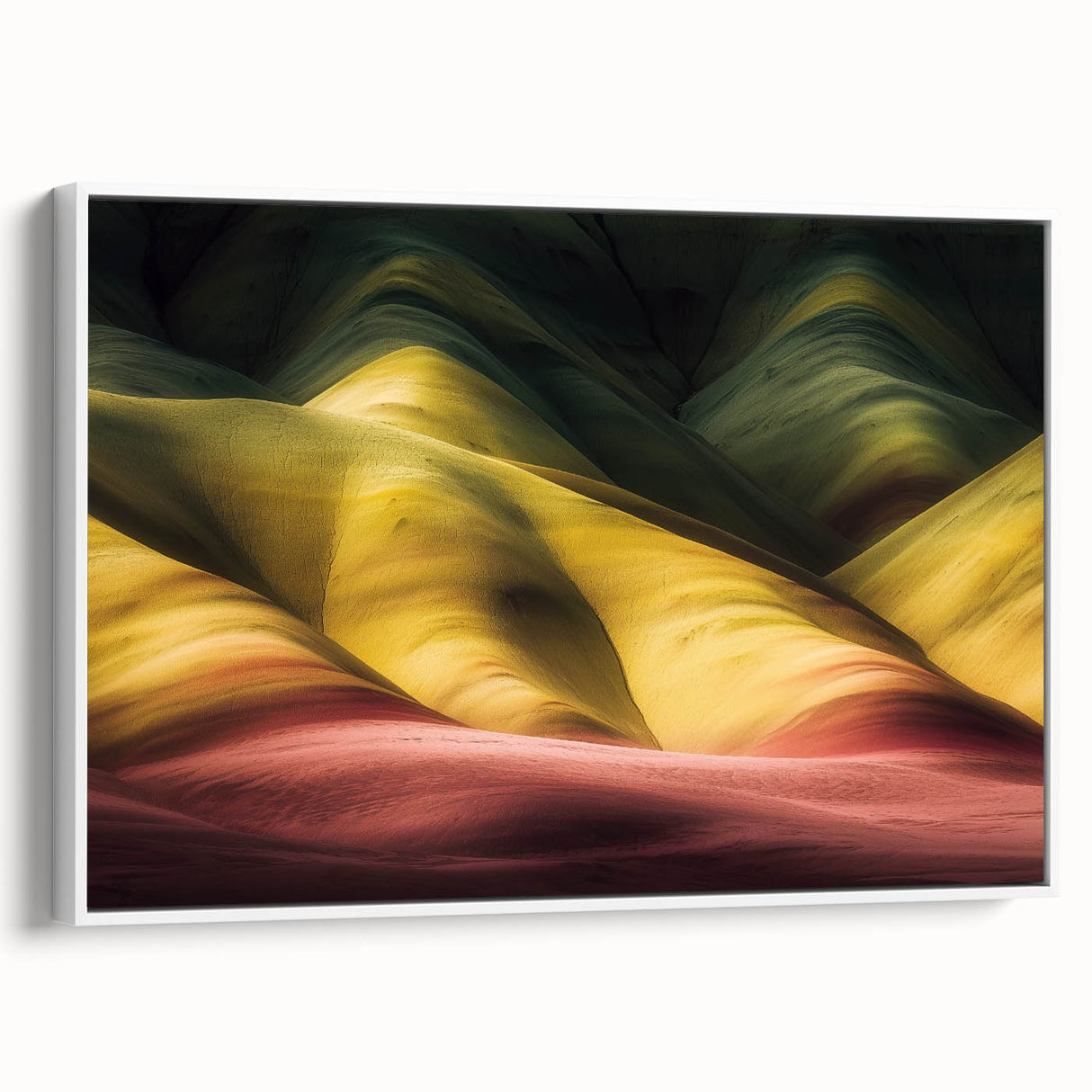 Framed landscape canvas art depicting vibrant canyons in warm earthy tones, showcasing a white frame and side view, perfect for home decor and nature enthusiasts.