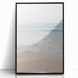 Large abstract wall art featuring swirling blue and orange hues on a black acrylic print, ideal for modern living room decor.