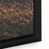 Vintage poster art of an autumn scene in muted orange and brown tones on a framed canvas, ideal for living room decor.
