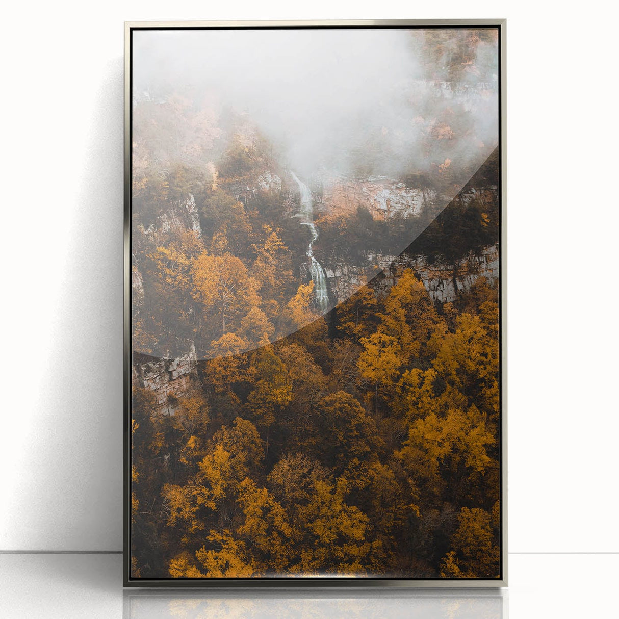 Mid-century modernist art depicting an abstract autumn scene in orange and brown tones, framed in silver acrylic.