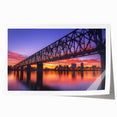 Stunning landscape bridge artwork printed on high-quality canvas, rolled neatly in a protective cardboard tube, showcasing vibrant colors and intricate details.