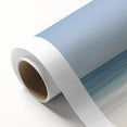 Rolled canvas featuring a serene beach landscape design with vibrant blue skies and soft waves, elegantly packaged in a protective cardboard tube for easy transport.