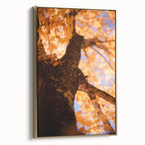 Framed canvas featuring a vintage-style landscape painting of an autumnal scene with golden and black hues.