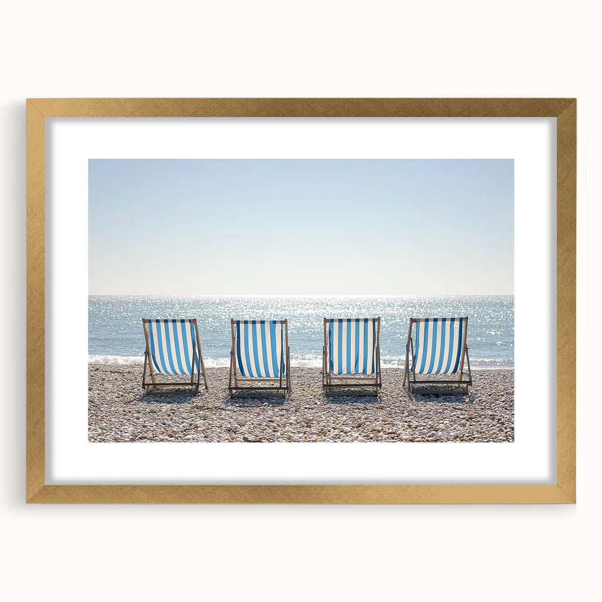 Elegant landscape artwork framed in gold, featuring serene beach scenery with soft waves and vibrant sunset hues, perfect for home decor or office ambiance.
