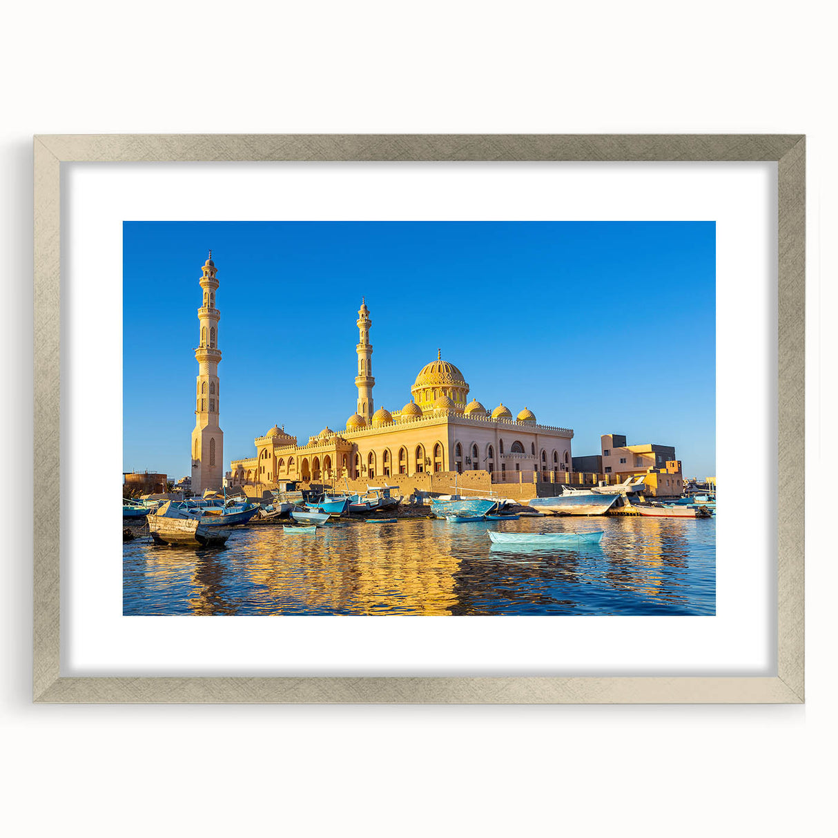 Abstract art print of Egyptian scenery in muted gold and blue tones on a framed poster, suitable for dining room decor.