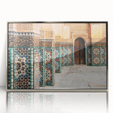 Art deco poster featuring a Moroccan landscape in muted earth tones on a silver-framed acrylic print.