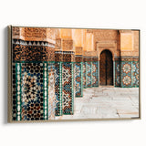 Framed canvas depicting a Moroccan landscape with vibrant colors on a black background, ideal for living room decor.