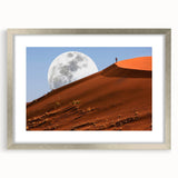 Abstract art print of a Namibian landscape in muted earth tones on a silver-framed canvas, suitable for dining room decor.