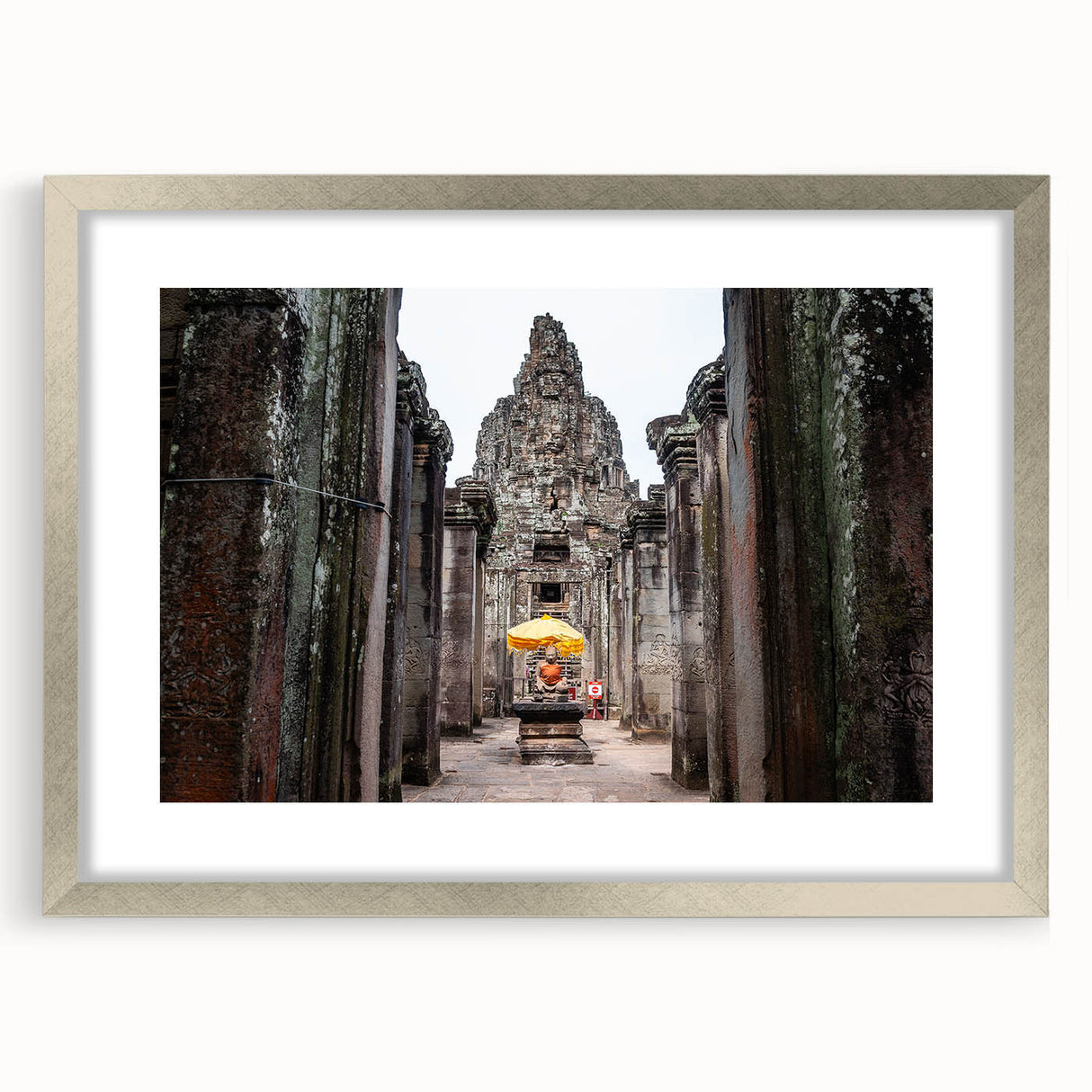 Textured art print depicting an abstract Cambodian landscape in muted earth tones, framed in silver.