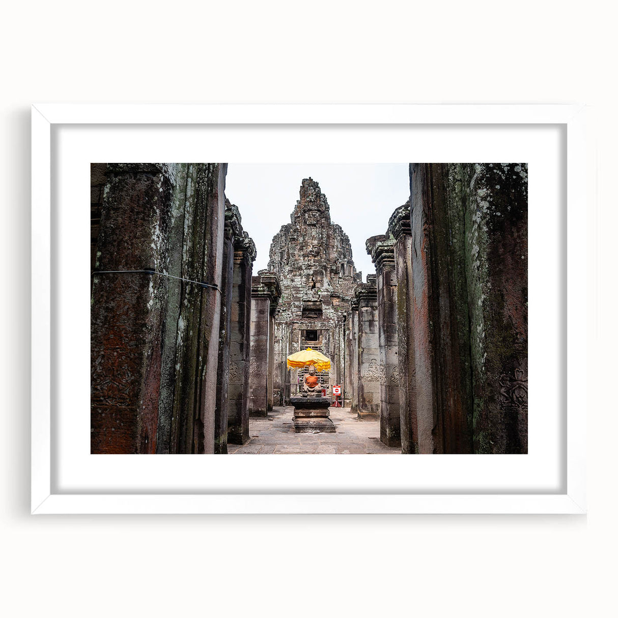 Abstract art print depicting a Cambodian landscape in muted earth tones on a framed white mat.