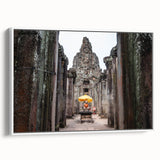 Vintage poster art of a Cambodian scenery on a framed canvas, featuring vibrant colors ideal for living room decor.