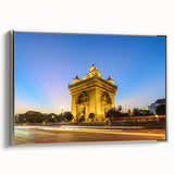 Framed canvas featuring a vintage-style landscape painting of a Laotian scenery in colorful tones.