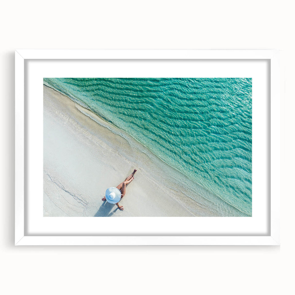 Abstract art print depicting a serene Maldivian landscape in cool blue and green tones, framed with a white mat.