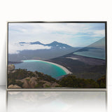 Framed acrylic print of a Tasmanian landscape in art deco style, featuring muted green and blue tones.