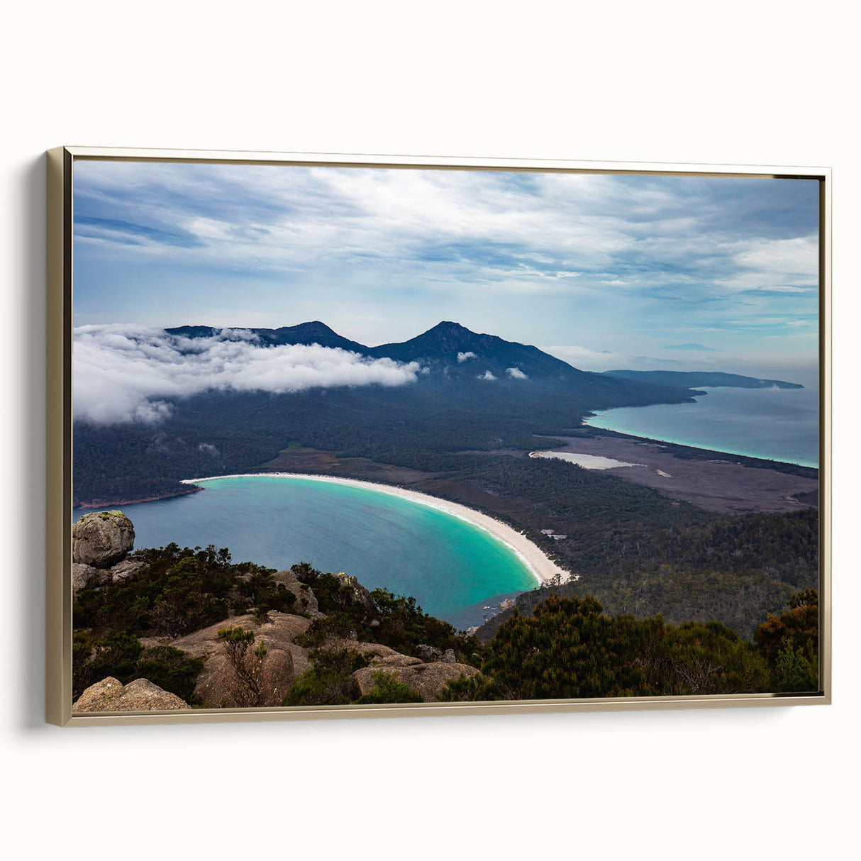 Vintage poster art of a Tasmanian landscape on framed canvas, featuring vibrant colors and black accents.